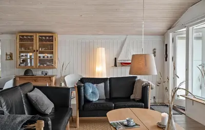 a living room with two black leather couches and a table at Pet Friendly Home In Vestervig With Wifi in Vestervig