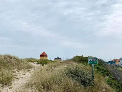 a speed limit sign on the side of a beach at 4 star holiday home in Thyborøn in Thyborøn