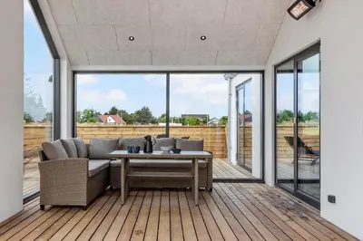 a living room with a couch and a table at 871-Thisted-Smedevej-3-A in Thisted