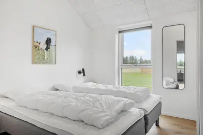 a white room with four beds and a window at 871-Thisted-Smedevej-3-A in Thisted