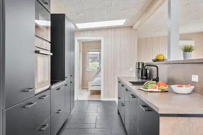 a kitchen with gray cabinets and a counter top at 158-Thisted-Lyngbakken-8 in Thisted