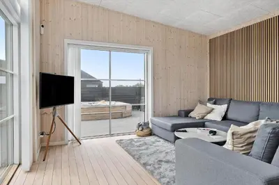 a living room with a couch and a tv at 158-Thisted-Lyngbakken-8 in Thisted