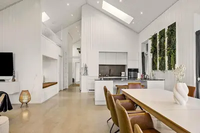 a kitchen and dining room with a table and chairs at 1314-Thisted-Lyngbakken-14 in Thisted