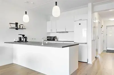 a kitchen with white cabinets and a counter top at 781-Thisted-Havstokken-28-A in Thisted