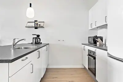 a white kitchen with a sink and a stove at 781-Thisted-Havstokken-28-A in Thisted