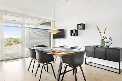 a dining room with a table and some chairs at 781-Thisted-Havstokken-28-A in Thisted