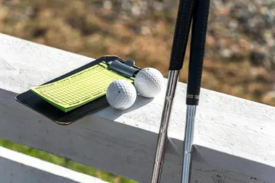 two golf balls and a bat on a bench at 212-Vestervig-Havnevej-1-lejl-12 in Vestervig