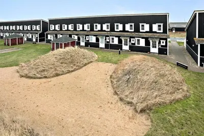 a large building with hay bales in front of it at 212-Vestervig-Havnevej-1-lejl-12 in Vestervig