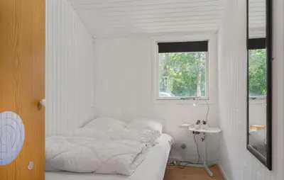 a white room with a bed and a window at 3 Bedroom Amazing Home In Aabybro in Åbybro