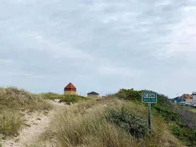 a speed limit sign on the side of a beach at 4 star holiday home in Thyborøn in Thyborøn