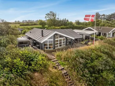 an aerial view of a house with a flag at Holiday Home Diderik - 20m to the fjord by Interhome in Roslev
