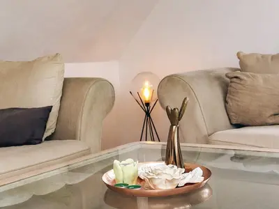 a living room with two couches and a coffee table at 6 person holiday home in Vestervig in Vestervig