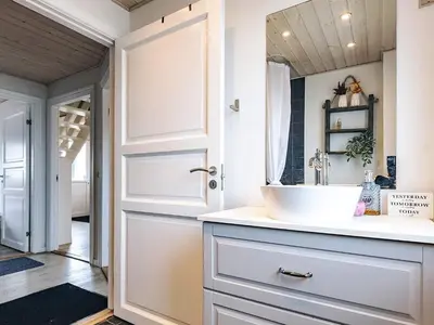 a bathroom with a sink and a mirror at 6 person holiday home in Vestervig in Vestervig