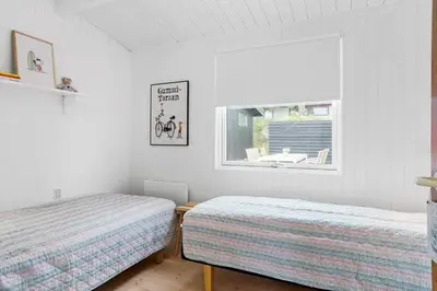 a bedroom with two beds and a window at 399-Thisted-Sotungevej-21 in Nørre Vorupør