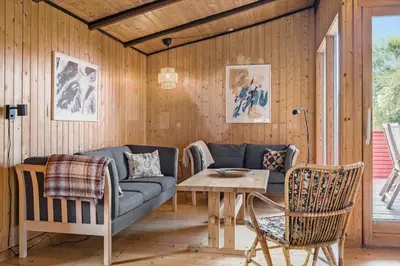 a living room with a couch and a table at 421-Thisted-Fiskervej-147 in Nørre Vorupør