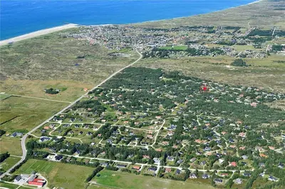 an aerial view of a town with houses and the ocean at 880-Thisted-Havtornvej-4 in Thisted