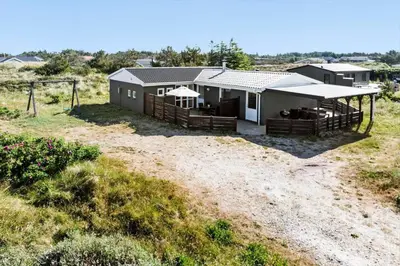 a house on top of a hill in a field at 1046-Thisted-Johns-Vej-26 in Torsted