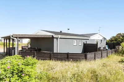 a house with a fence in front of it at 1046-Thisted-Johns-Vej-26 in Torsted