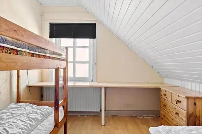 a bedroom with a bunk bed and a desk at 823-Thisted-Knottivej-3 in Thisted