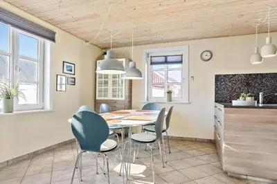 a kitchen and dining room with a table and chairs at 823-Thisted-Knottivej-3 in Thisted