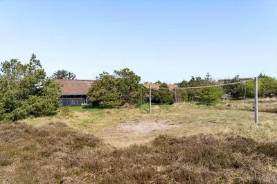 an empty field with a fence and a house at 528-Thisted-Tunvej-28 in Thisted