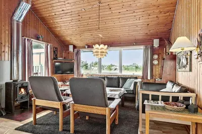 a living room with a couch and a fireplace at 323-Thisted-Pighvarvej-27 in Thisted