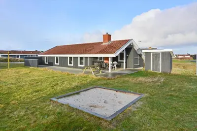 a house with a sandbox in front of it at 1318-Thisted-Nordsovej-58 in Thisted