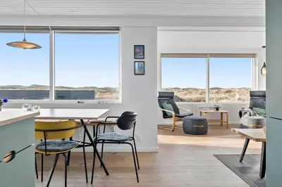 a kitchen and living room with a table and chairs at 106-Thisted-Simonsvej-6 in Thisted