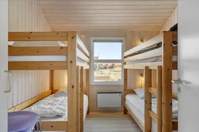 a room with two bunk beds and a window at 1026-Thisted-Niels-Vognmands-Vej-26 in Torsted