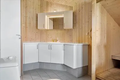 a bathroom with a white sink and a mirror at 1026-Thisted-Niels-Vognmands-Vej-26 in Torsted