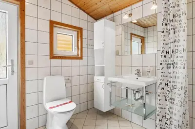 a bathroom with a toilet and a sink at 560-Thisted-Klitrosevej-60 in Thisted