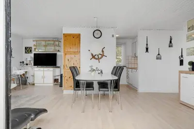 a kitchen and dining room with a table and chairs at 780-Thisted-Molgaardsvej-60 in Thisted