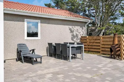 a patio with a table and chairs and a fence at 780-Thisted-Molgaardsvej-60 in Thisted
