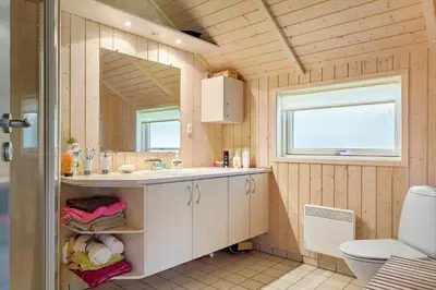 a bathroom with a sink and a mirror at 876-Thisted-Klemsvej-27 in Thisted