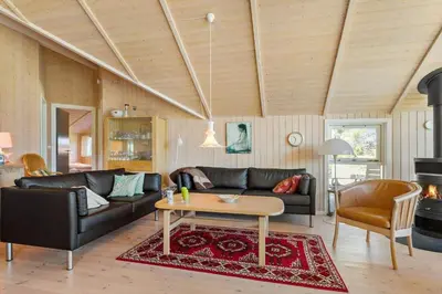 a living room with a couch and a table at 876-Thisted-Klemsvej-27 in Thisted