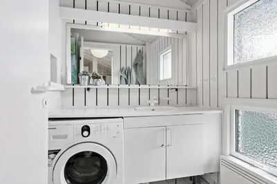 a white bathroom with a washing machine and a sink at 334-Snedsted-Somaerkevej-64-B in Snedsted