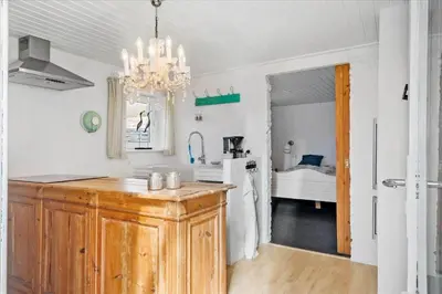 a kitchen with a chandelier and a sink at 846-Thisted-Vesterhavsgade-6-A in Thisted