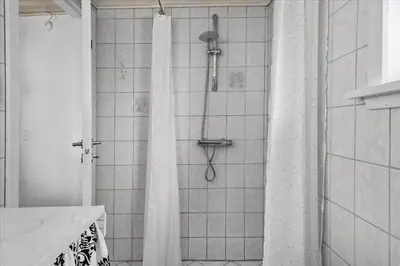 a shower with a shower curtain in a bathroom at 846-Thisted-Vesterhavsgade-6-A in Thisted