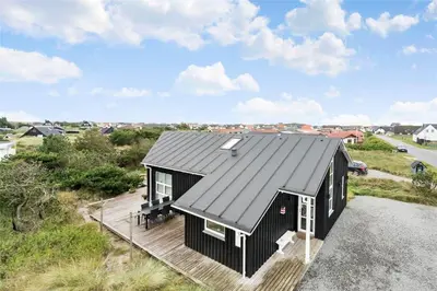 a black house with a black roof at 897-Thisted-Nordsovej-46-C in Thisted