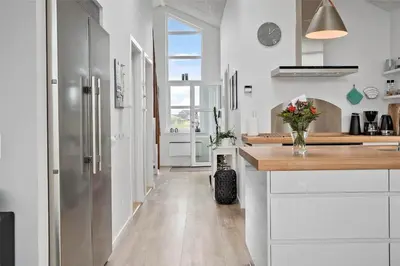 a kitchen with white cabinets and a counter top at 897-Thisted-Nordsovej-46-C in Thisted