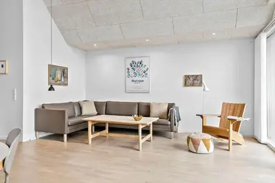 a living room with a couch and a table at 794-Thisted-Havstokken-26-1 in Thisted