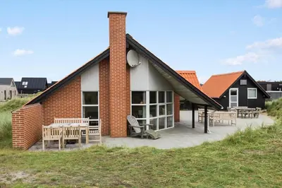 a brick building with tables and chairs in front of it at 150-Thisted-Orredvej-32 in Thisted