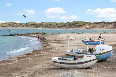 two boats sitting on a beach near the water at 792-Thisted-Havstokken-22-1 in Thisted