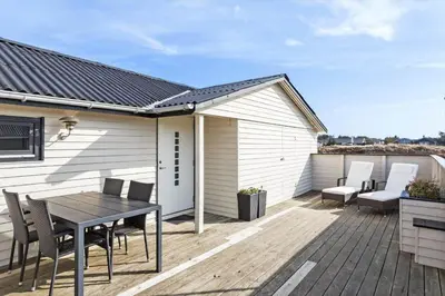 a patio with a table and chairs on a deck at 310-Thisted-Store-Knuds-Vej-7 in Thisted