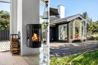 a fireplace on the side of a house at 1013-Thisted-Sine-Krokones-Vej-12 in Torsted
