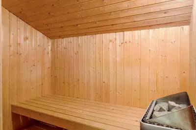 a corner of a sauna with a bench in it at 990-Thisted-Spanggardsvej-29 in Torsted