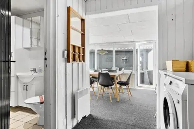 a kitchen and dining room with a table and chairs at 518-Thisted-Klemsvej-18 in Thisted