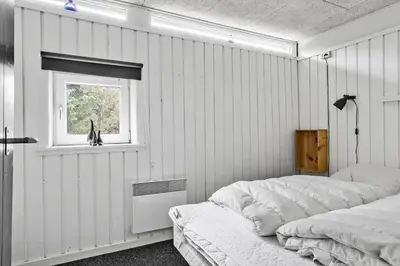 a bedroom with two beds and a window at 518-Thisted-Klemsvej-18 in Thisted