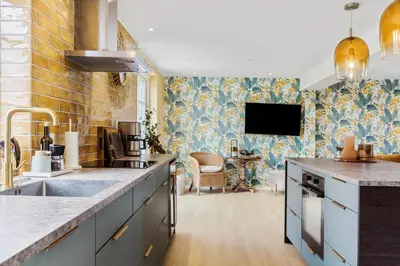 a kitchen with a sink and a tv on the wall at 193-Vestervig-Vesterhavsvej-36 in Vestervig