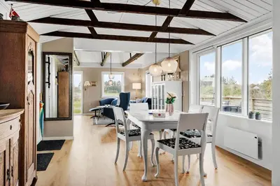 a kitchen and dining room with a table and chairs at 149-Snedsted-Lykkens-Hab-39 in Snedsted